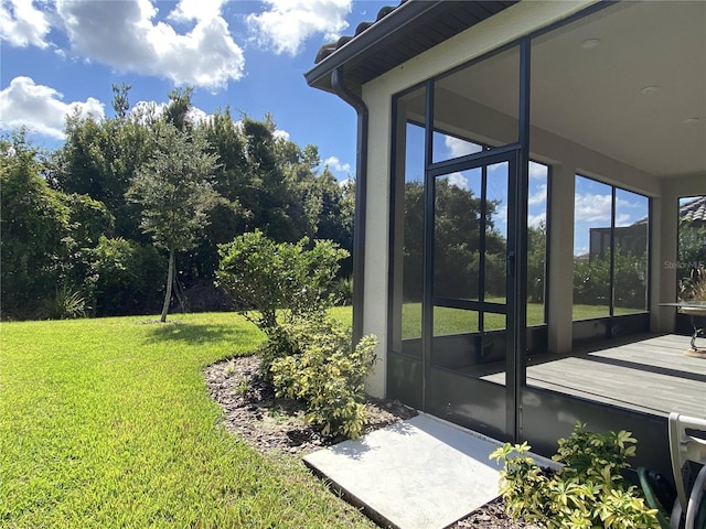 view of yard with a sunroom