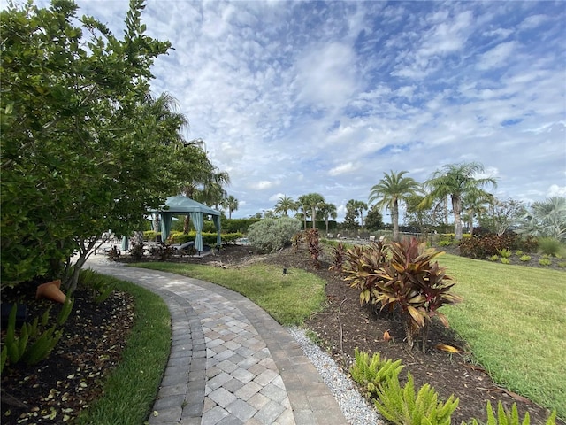 view of home's community with a gazebo and a yard