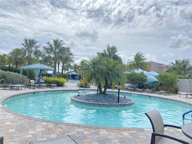 view of swimming pool featuring a patio