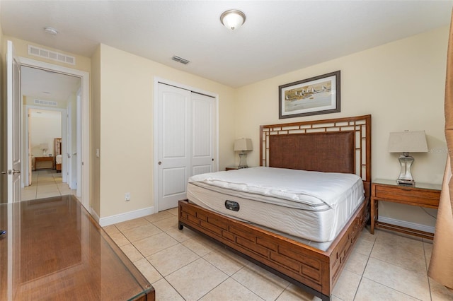 tiled bedroom featuring a closet