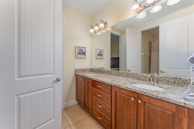 bathroom featuring tile patterned flooring and vanity