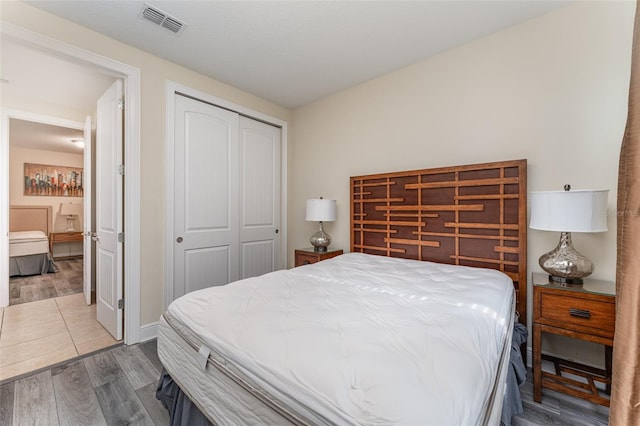 bedroom featuring hardwood / wood-style flooring and a closet