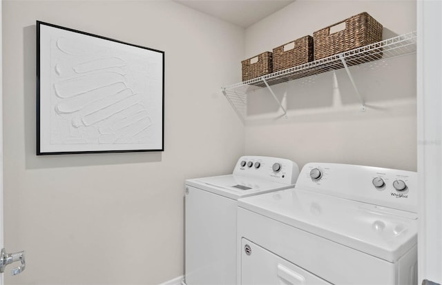 laundry room with separate washer and dryer