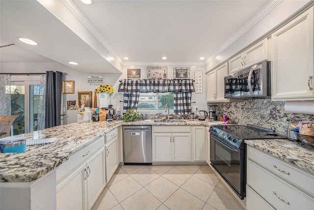 kitchen with sink, kitchen peninsula, stainless steel appliances, and light tile patterned floors