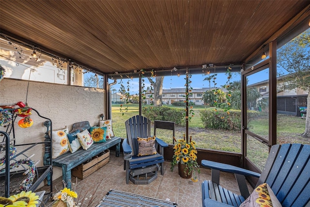 sunroom featuring wood ceiling