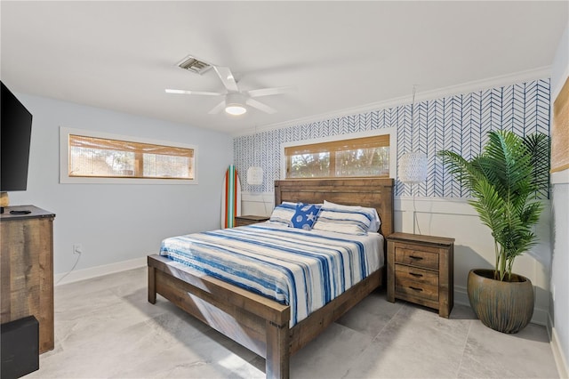 bedroom featuring multiple windows, ceiling fan, and ornamental molding