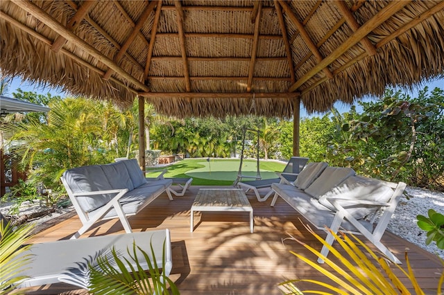 view of patio with a gazebo, a deck, and an outdoor living space