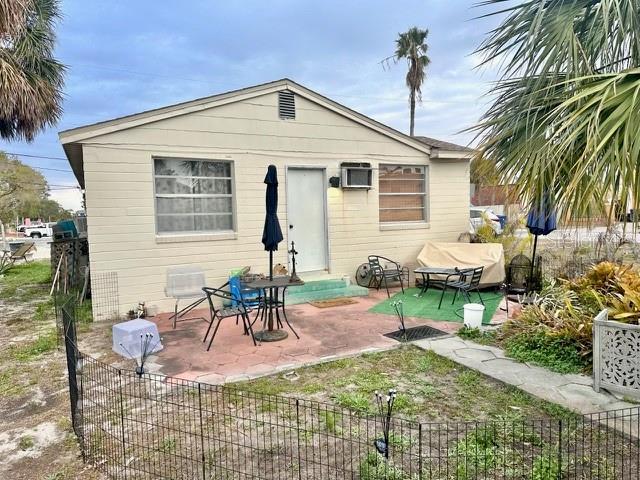 back of property featuring a patio