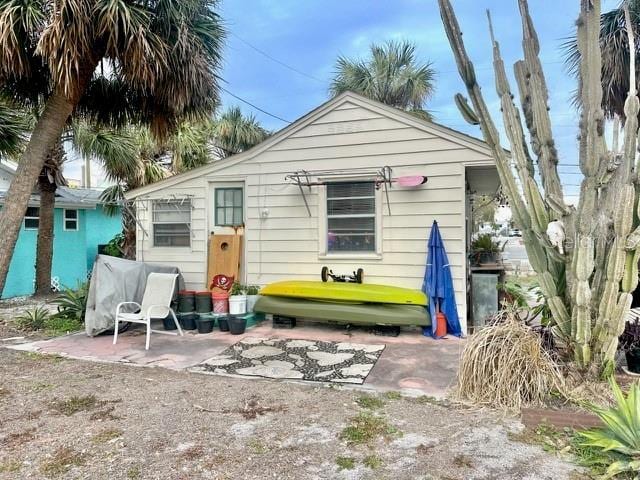 rear view of property featuring a patio