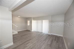 empty room with dark wood-type flooring