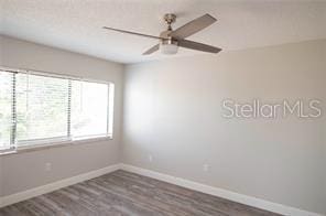 unfurnished room featuring dark hardwood / wood-style flooring