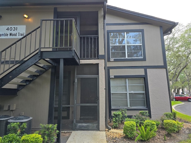 entrance to property with central AC unit