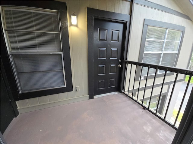 entrance to property with a balcony