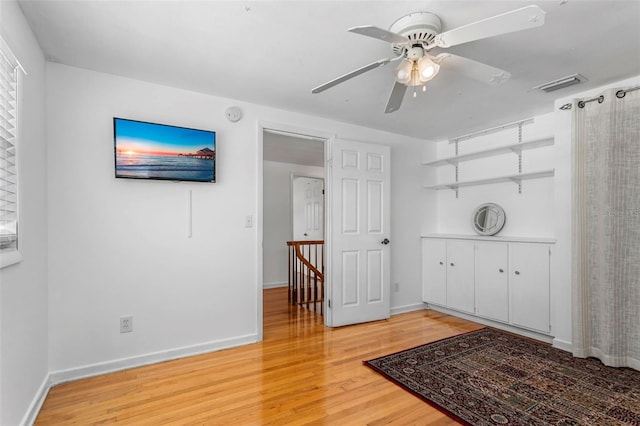 8716 Hickorywood Ln, Tampa, FL 33615 - interior space with visible vents, a ceiling fan, baseboards, and light wood-type flooring