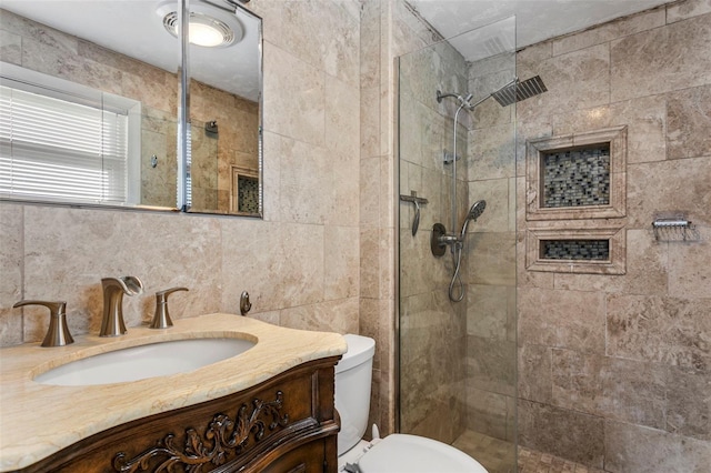 8716 Hickorywood Ln, Tampa, FL 33615 - bathroom featuring vanity, toilet, tiled shower, and tile walls