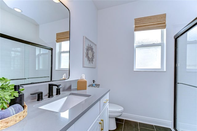 bathroom featuring tile patterned flooring, a healthy amount of sunlight, and a shower with shower door