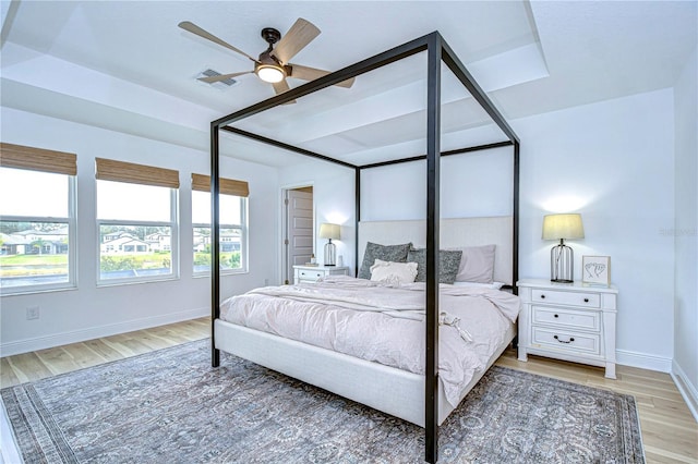 bedroom with ceiling fan and hardwood / wood-style floors