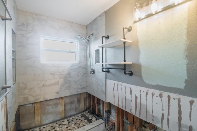 bathroom with a tile shower