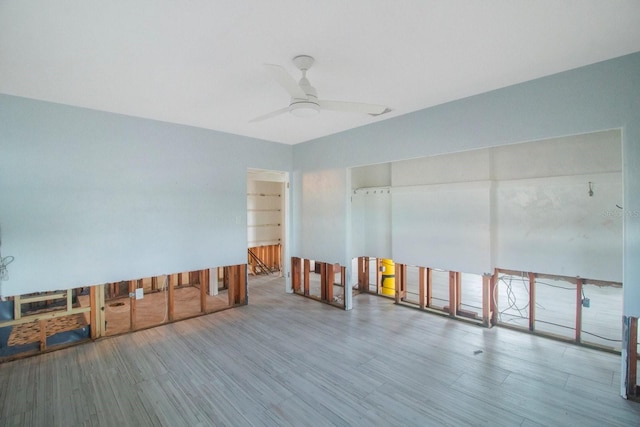 miscellaneous room with ceiling fan and wood-type flooring