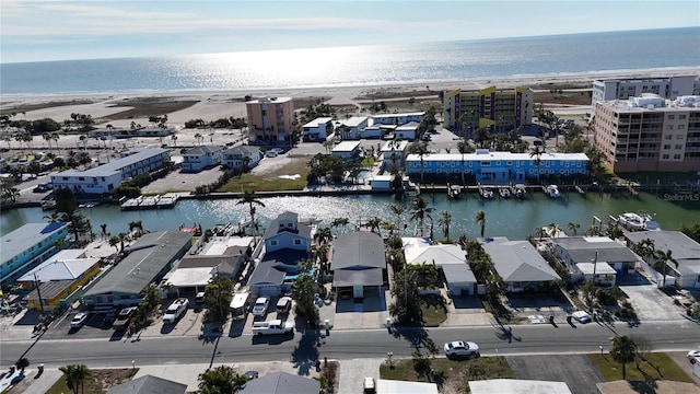 aerial view featuring a water view and a beach view