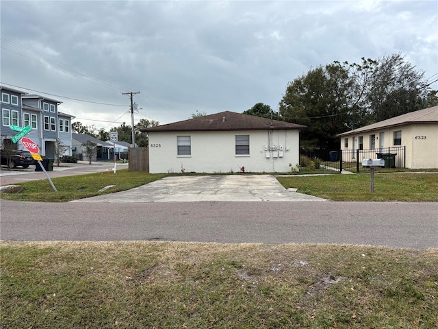 view of property exterior with a lawn