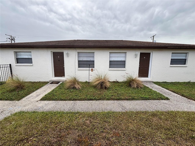 ranch-style house with a front yard