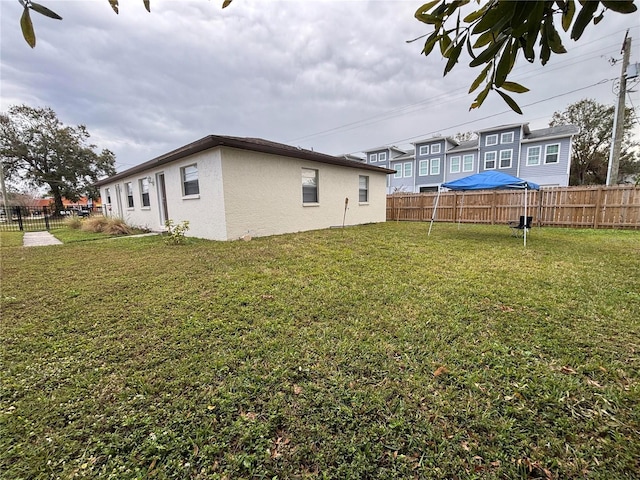 view of home's exterior with a yard