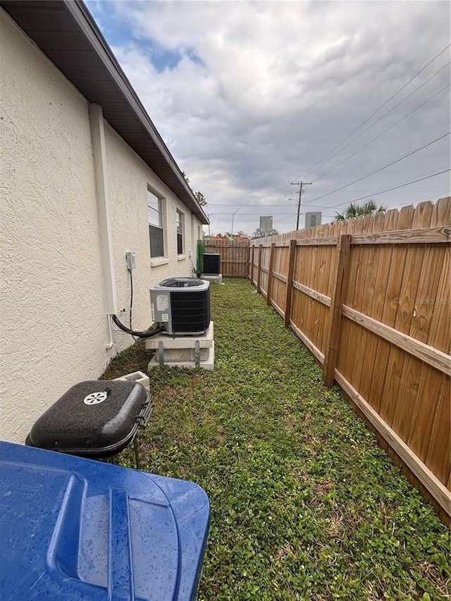 view of yard featuring central AC