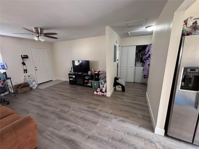 living room with wood-type flooring and ceiling fan