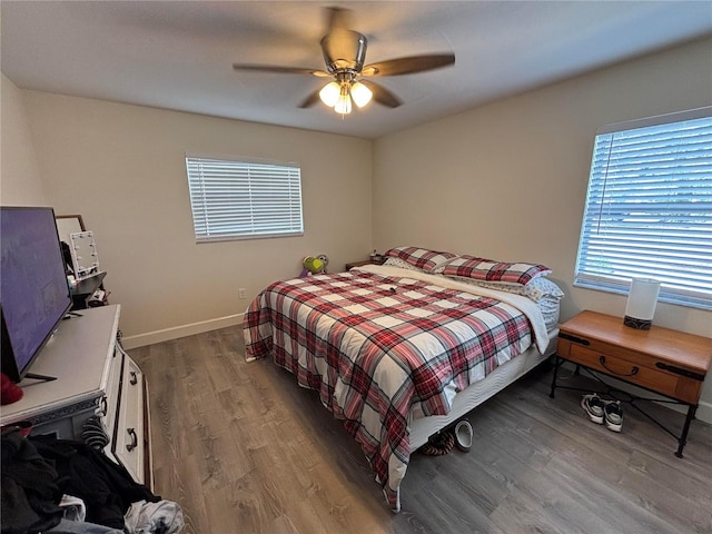 bedroom with hardwood / wood-style floors and ceiling fan