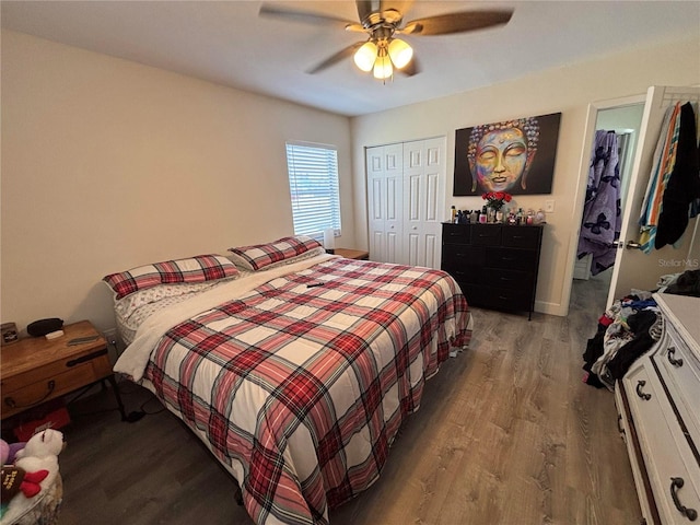 bedroom featuring ceiling fan, a closet, and hardwood / wood-style flooring