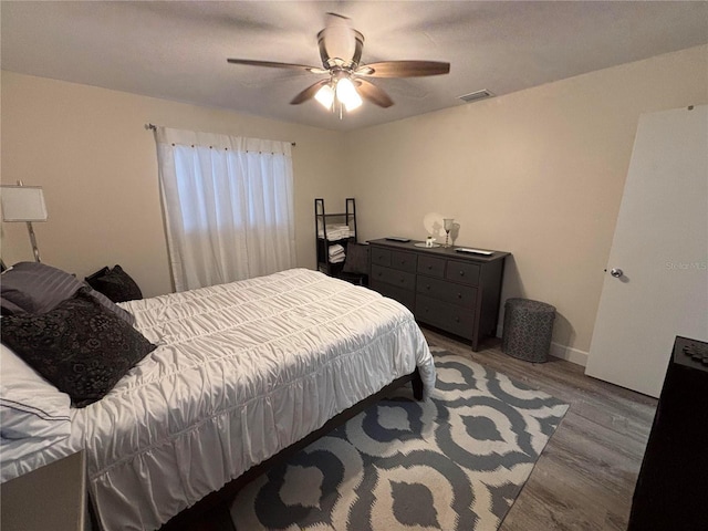 bedroom featuring ceiling fan and hardwood / wood-style floors