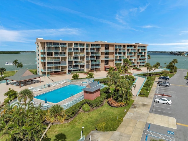 view of swimming pool with a water view