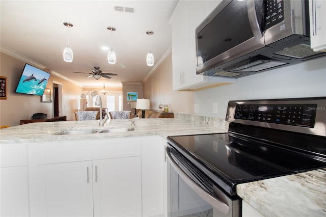 kitchen featuring sink, appliances with stainless steel finishes, white cabinetry, hanging light fixtures, and kitchen peninsula