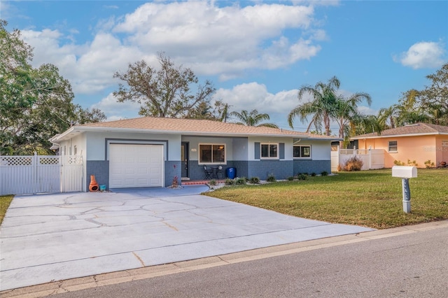 ranch-style house with a garage and a front lawn