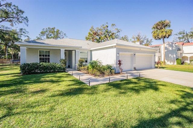 ranch-style home with a front lawn and a garage