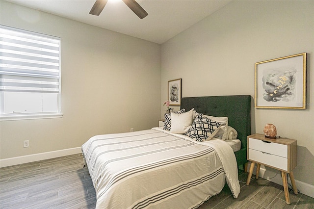 bedroom with hardwood / wood-style flooring and ceiling fan