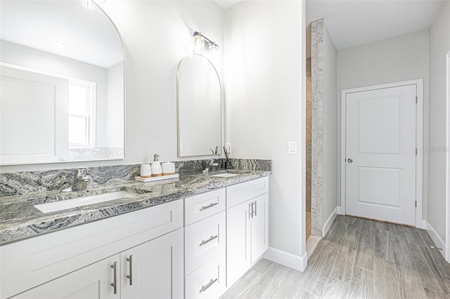 bathroom featuring hardwood / wood-style flooring and vanity