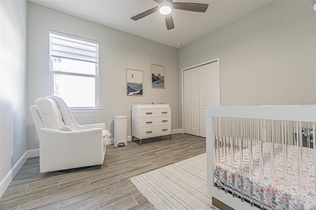 bedroom with ceiling fan and a closet