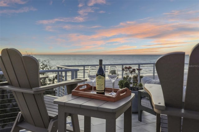 balcony at dusk with a water view