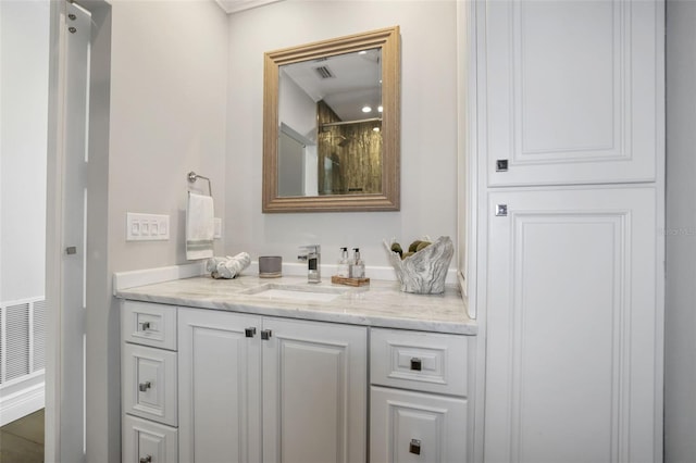 bathroom featuring visible vents and vanity