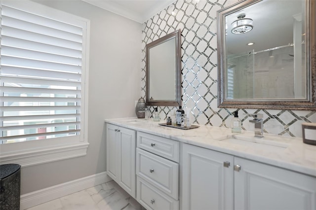 full bath featuring marble finish floor, a stall shower, a sink, double vanity, and baseboards