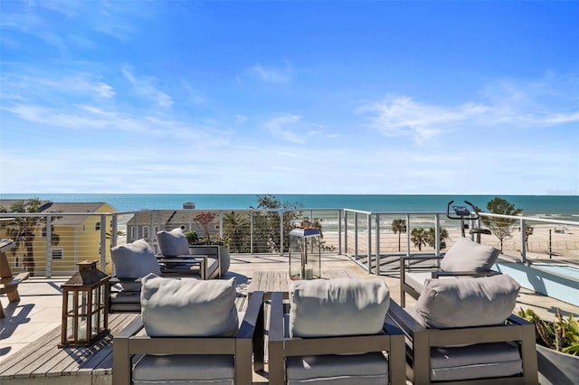 view of patio / terrace featuring a water view and outdoor lounge area