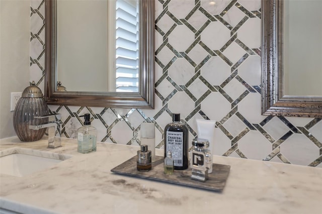 details with tasteful backsplash, a dry bar, and vanity