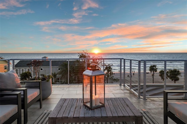 deck featuring a water view and an outdoor hangout area