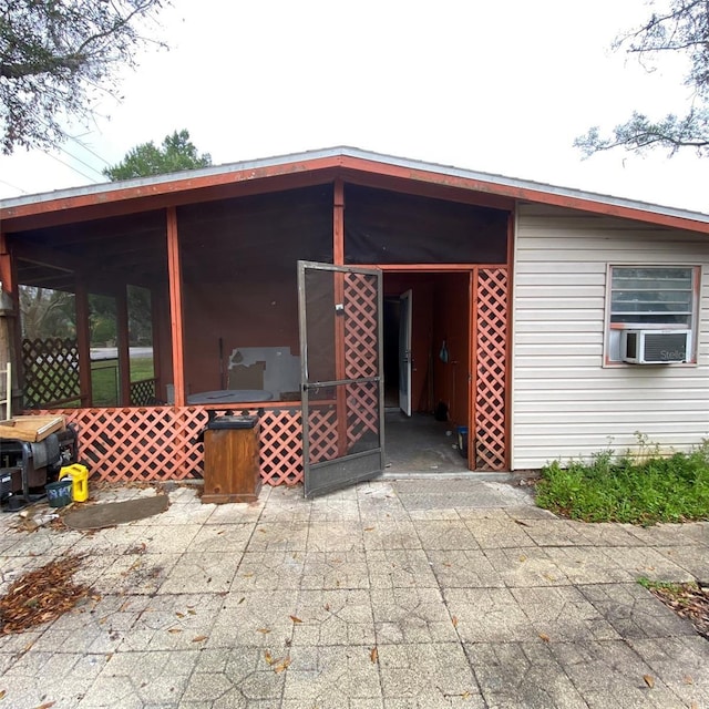 rear view of house with cooling unit