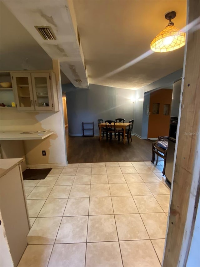 dining space with light tile patterned floors