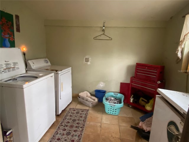 laundry area featuring washing machine and clothes dryer