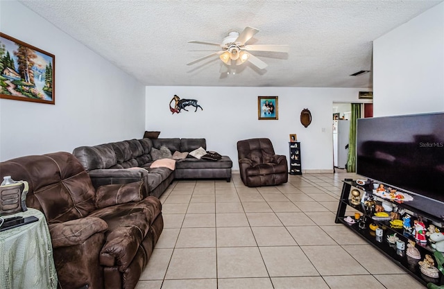 tiled living room featuring a textured ceiling and ceiling fan