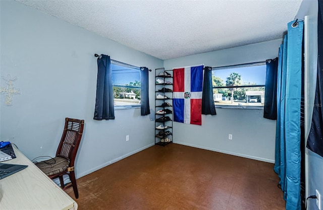 home office featuring a textured ceiling